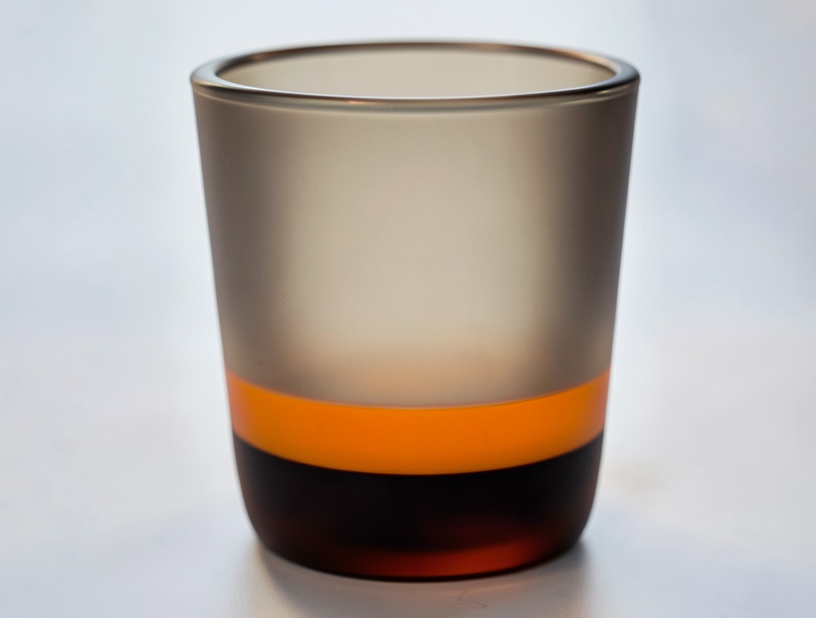 Adding the orange liqueur top layer to a B-52