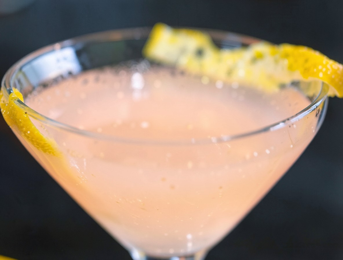 Orange peel expressed over a finished Monkey Gland cocktail